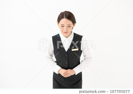 Woman in uniform business bowing Woman in uniform business bowing 107705077