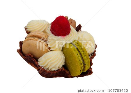 Tartlet with macaroons, whipped cream and raspberry isolated on white background 107705430
