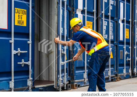 Warehouse engineer worker working at industrial container yard 107705555