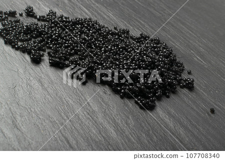Black Caviar Texture Background, Sturgeon, Sevruga, Beluga Caviare Mockup, Luxury Seafood with Copy Space Black Caviar Texture Background, Sturgeon, Sevruga, Beluga Caviare Mockup, Luxury Seafood with Copy Space 107708340