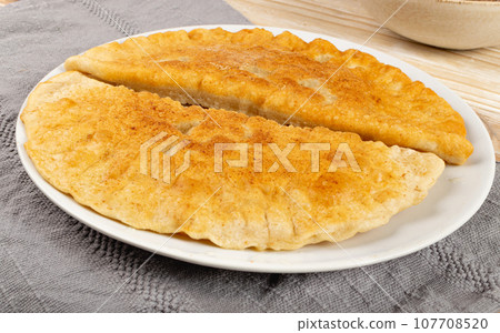 Deep-Fried Flat Pie. Turnover with Filling of Ground Meat and Onions, Stuffed Chebureki, 107708520