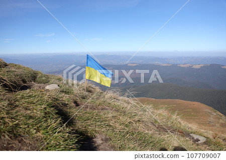 Ukrainian flag on top of Hoverla mountain in Ukraine Ukrainian flag on top of Hoverla mountain in Ukraine 107709007