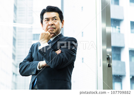 Middle management working in the office Middle management working in the office 107709882