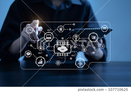 Male using tablet for working technology and business,  Renewable energy-based green businesses and global warming. Reduce CO2 emission. 107710620