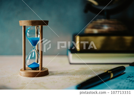 desk with hourglass 107713331