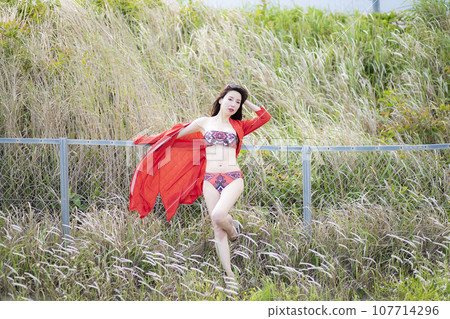 Beautiful Mrs. in a red bikini 107714296