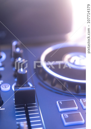 Dj turntables in nightclub 107714379