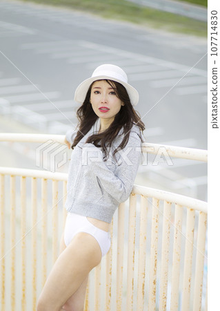 Beautiful Mrs. in a white bikini 107714830