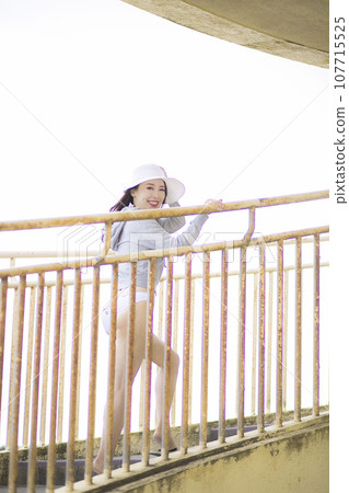 Beautiful Mrs. in a white bikini 107715525