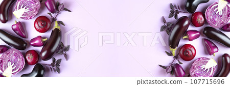 Banner of fresh vegetables eggplants, cabbage, pepper, onion and basil leaves of on pastel lilac lavender background. Creative food concept. Flat lay, top view. 107715696