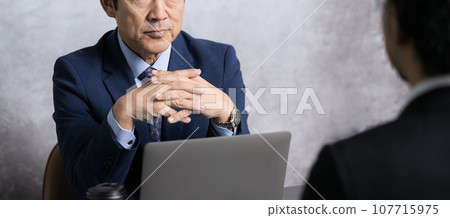 Middle-aged man in a suit, business scene of president or HR interviewer, faceless Middle-aged man in a suit, business scene of president or HR interviewer, faceless 107715975