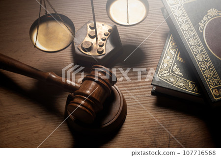 Judge gavel and legal book on wooden table 107716568