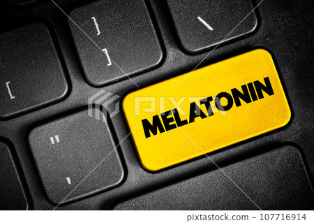 Melatonin is a hormone that your brain produces in response to darkness, text button on keyboard, concept background 107716914