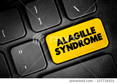 Alagille Syndrome is a genetic disorder that can affect the liver, heart, and other parts of the body, text button on keyboard, concept background 107716918