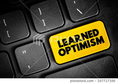 Learned Optimism - developing the ability to view the world from a positive point of view, text button on keyboard, concept background 107717100