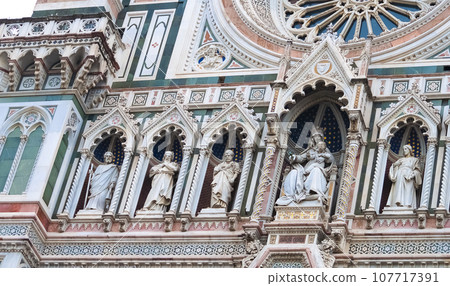 Details of the exterior of the di Santa Maria del Fiore or Cathedral of Saint Mary of the Flower - the main church of Florence, Tuscany, Italy. Details of the exterior of the di Santa Maria del Fiore or Cathedral of Saint Mary of the Flower - the main church of Florence, Tuscany, Italy. 107717391