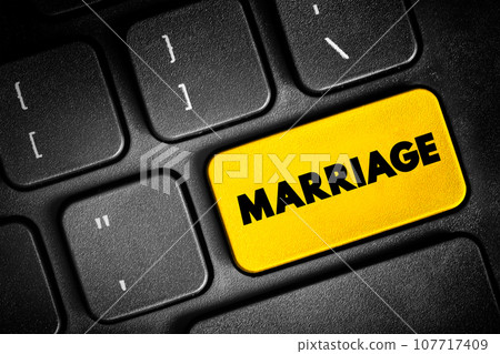 Marriage - the legally or formally recognized union of two people as partners in a personal relationship, text button on keyboard, concept background Marriage - the legally or formally recognized union of two people as partners in a personal relationship, text button on keyboard, concept background 107717409