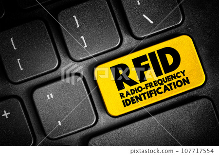 RFID Radio-Frequency Identification - electromagnetic fields to automatically identify and track tags attached to objects, text button on keyboard 107717554