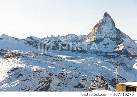 Snowy mountain Matterhorn during the day in winter. Zermatt, swiss alps Snowy mountain Matterhorn during the day in winter. Zermatt, swiss alps 107719270