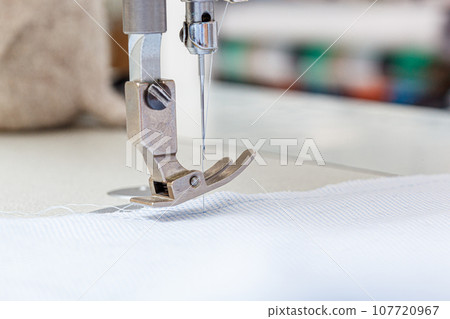 Sewing machine needle with thread and fabric Sewing machine needle with thread and fabric 107720967
