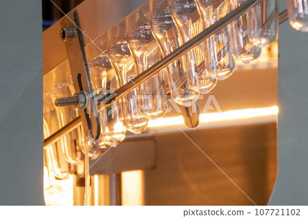 The drinking water bottle manufacturing process by blow mold machine. The drinking water bottle manufacturing process by blow mold machine. 107721102