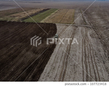 Agricultural machinery in the field, aerial view. Agricultural work. 107723418