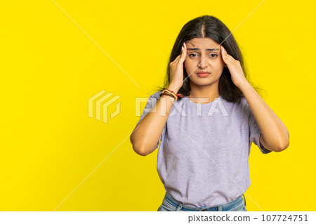 Indian woman rubbing temples to cure headache problem, suffering from tension, migraine stress pain Indian woman rubbing temples to cure headache problem, suffering from tension, migraine stress pain 107724751
