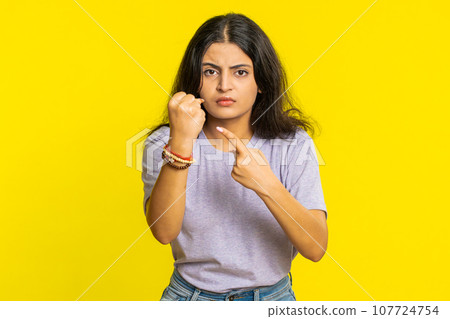 Aggressive angry Indian woman trying to fight at camera, shaking fist, boxing, punishment, threaten Aggressive angry Indian woman trying to fight at camera, shaking fist, boxing, punishment, threaten 107724754
