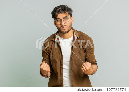 Irritated angry Indian man screams from stress tension problems, shock, rage, nervous, quarrel 107724774