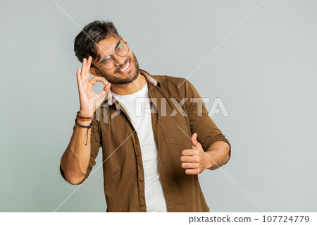 Happy Indian man showing ok gesture, like sign positive feedback , celebrate victory, approve idea Happy Indian man showing ok gesture, like sign positive feedback , celebrate victory, approve idea 107724779