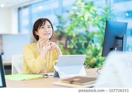 Female employees who do desk work Female employees who do desk work 107726251