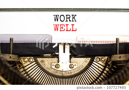 Work well symbol. Concept words Work well typed on beautiful old retro typewriter. Beautiful white paper background. Business marketing, motivational work well concept. Copy space. 107727493