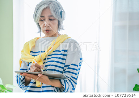 Senior woman with tablet Senior woman with tablet 107729514