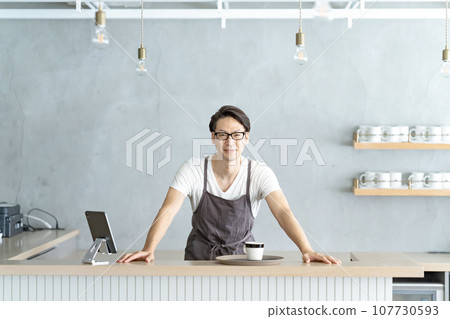 Smiling cafe worker male Smiling cafe worker male 107730593