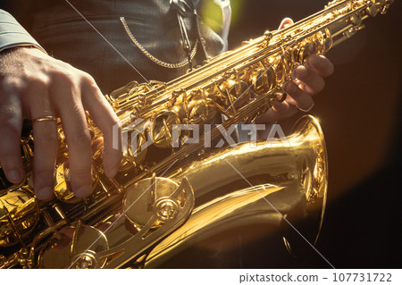 Young man playing the Saxophone 107731722