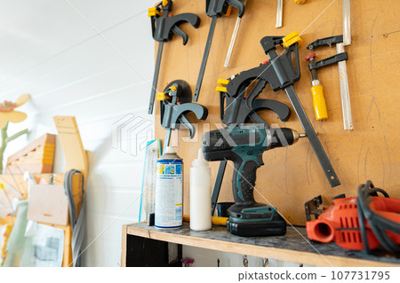 Set of tools in the workshop close up 107731795