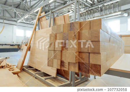 Stacked wooden bars in workshop of furniture manufacture 107732058
