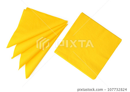 Yellow paper napkins on white background studio shot 107732824