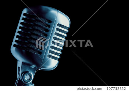 vintage microphone over black 107732832