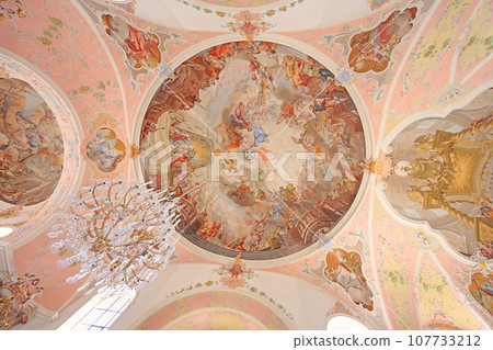 Ceiling and chandelier of St Peter St Paul Church. Joseph Schmuzer led the construction of the church. The ceiling and wall frescoes were made by Matthew Guenthe. Ceiling and chandelier of St Peter St Paul Church. Joseph Schmuzer led the construction of the church. The ceiling and wall frescoes were made by Matthew Guenthe. 107733212