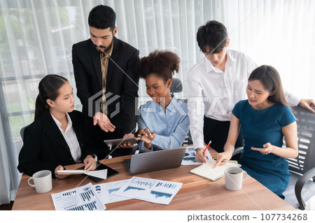 Multiracial analyst team use BI dashboard for data analysis with laptop. Concord 107734268