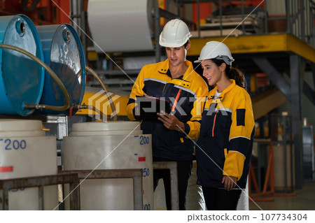 Two inventory inspector conduct inspection in chemical plant. Exemplifying Two inventory inspector conduct inspection in chemical plant. Exemplifying 107734304