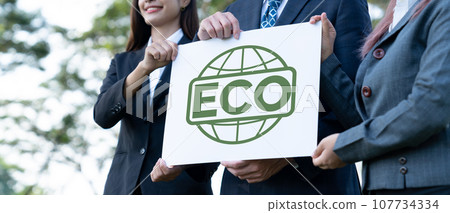 Group of business people stand united, holding eco-friendly idea. Gyre 107734334
