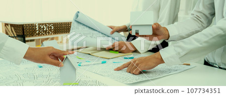 Worker, architect and engineer work on real estate construction project oratory Worker, architect and engineer work on real estate construction project oratory 107734351