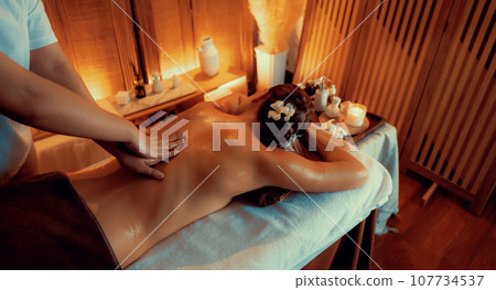 Caucasian woman customer enjoying relaxing anti-stress massage. Quiescent 107734537