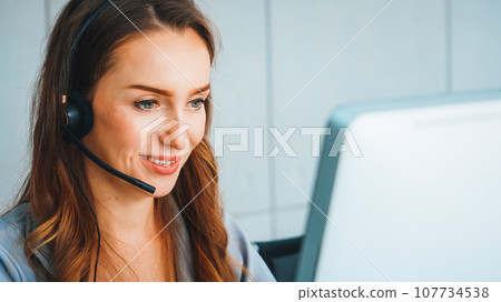 Business people wearing headset working in office Jivy 107734538