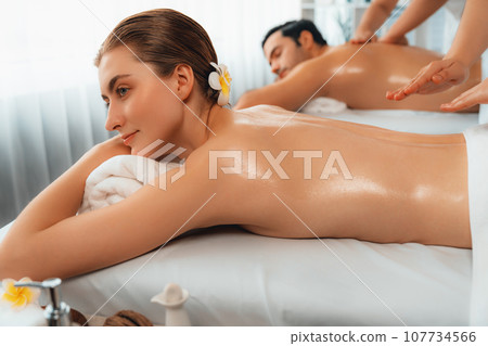 Caucasian couple customer enjoying relaxing anti-stress massage. Quiescent 107734566