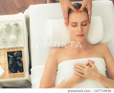 Panorama top view woman enjoying relaxing anti-stress head massage. Quiescent Panorama top view woman enjoying relaxing anti-stress head massage. Quiescent 107734696