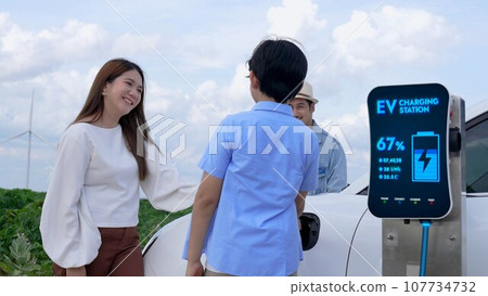 Modern family travel and nature with eco-friendly EV car concept. Peruse Modern family travel and nature with eco-friendly EV car concept. Peruse 107734732