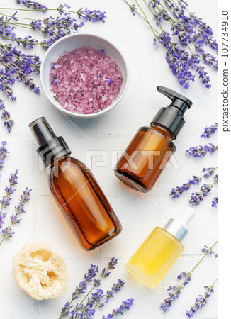 Lavender spa. Lavender salt, natural essential oil and fresh lavender Lavender spa. Lavender salt, natural essential oil and fresh lavender 107734910